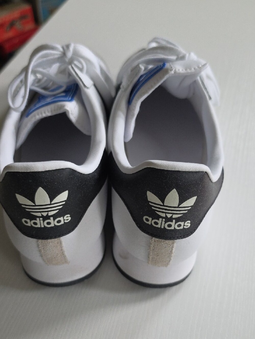 adidas White Sneakers with Black Stripes and Blue Tongue Accent - Picture 3 of 6